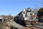 The train rests right next to the Flanders Fire Department, located out of view on the left